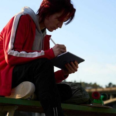 A person using Apple Pencil on the new iPad Air.