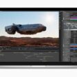 A MacBook Pro screen shows a graphics artist’s workflow.