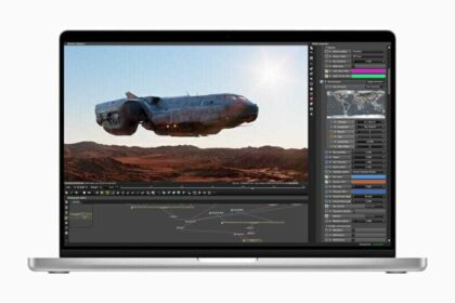 A MacBook Pro screen shows a graphics artist’s workflow.