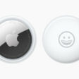 Front and back view of AirTag personalised with a smiley-face emoji.
