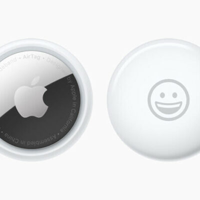 Front and back view of AirTag personalised with a smiley-face emoji.