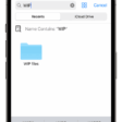An image of the Files app on iPhone showing a search for “WIP” and a “WIP files” folder icon onscreen below.  