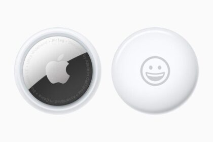 Front and back view of AirTag personalised with a smiley-face emoji.  
