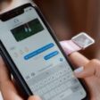 person sending an iMessage on their iPhone  