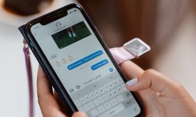 person sending an iMessage on their iPhone  