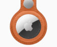 The new AirTag with the FineWoven Key Ring in fox orange.