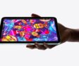 A person holding the new iPad mini.