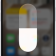 The iPhone Home Screen with Dark Mode on.