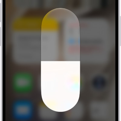 The iPhone Home Screen with Dark Mode on.