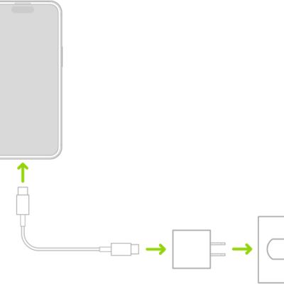 iPhone connected to the power adapter plugged into a power outlet.