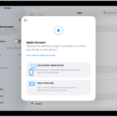 The Settings app, with the Apple Account sign-in dialog in the middle of the screen.