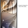 A custom Lock Screen in the process of being edited. Elements available for customization are selected—the date, the time, and a button for adding widgets.