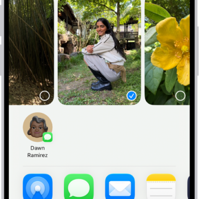 A selected photo is displayed in the top half of the iPhone screen, with a row of share options below. Additional options appear below those, including Copy Photo, Add to Shared Album, Add to Album, and Use as Wallpaper.