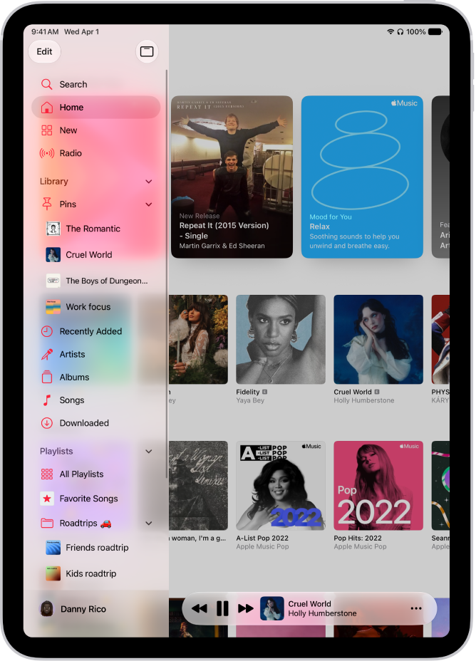 The Music app open on iPad showing the sidebar on the left and albums on the right. The MiniPlayer is at the bottom.