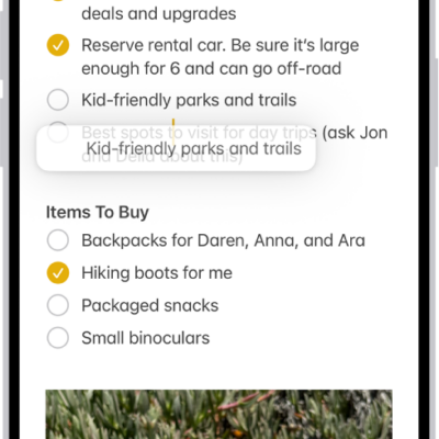 A document is open in the Notes app. The onscreen keyboard is in the bottom half of the screen. Selected text is lifted within the document to be moved to a new location.