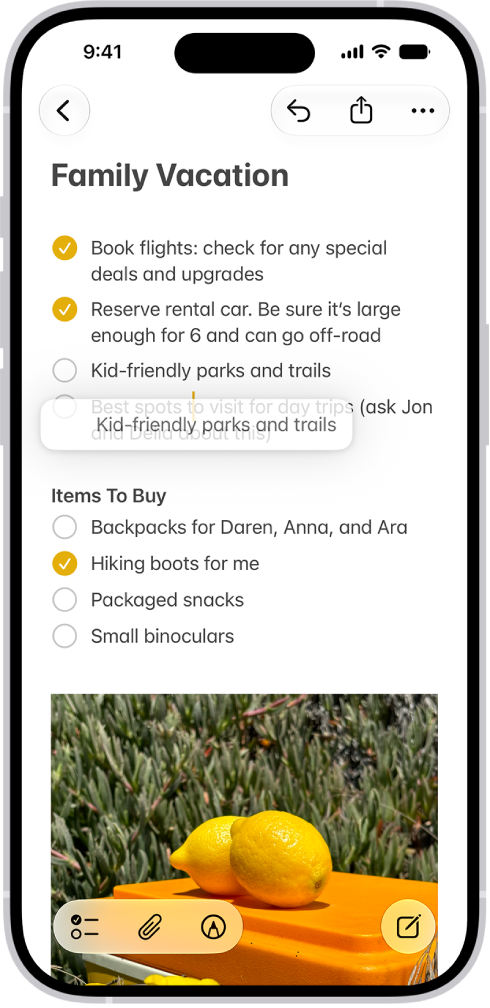 A document is open in the Notes app. The onscreen keyboard is in the bottom half of the screen. Selected text is lifted within the document to be moved to a new location.