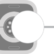 The concave end of the charger magnetically snaps to the back of Apple Watch.