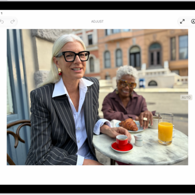 The Edit screen of the Photos app showing a photo in the center. To the left of the photo are the Style, Adjust, Crop, and Clean Up buttons; Adjust is selected. To the right of the photo are buttons for editing effects and a slider to adjust each effect level.