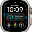 The Modular Ultra watch face showing elevation on the left and right (feet on the left and meters on the right), Music, Compass, and Compass Waypoints complications along the top, a digital clock below, a Compass Heading complication in the middle, and the Messages, Sunrise, and Workout complications near the bottom. At the very bottom is the current elevation.