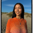 An open photo with thumbnails of other photos across the bottom of the screen. At the top left is a Back button to go back to browsing.