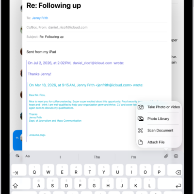 A draft email being composed with the attachment options above the keyboard.