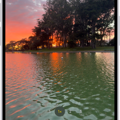The Camera screen in Photo mode. Within the viewfinder is a night scene. Buttons for Night and Camera Controls mode appear in the top-right corner of the screen. At the bottom of the screen are, from left to right, the Photo and Video Viewer button, Video and Photo Mode, and the Camera Chooser Back-Facing button.