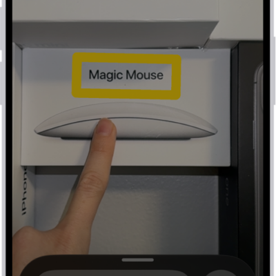 The Magnifier app detecting a finger pointing at text on a wall.