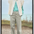 A person's height being measured in the Measure app, with the height measurement showing at the top of the person's head. The Take Picture button is near the lower-right corner for taking a picture of the measurement. The green Camera In Use indicator appears at the top.