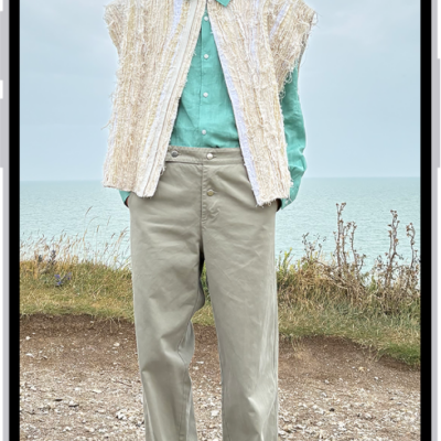 A person's height being measured in the Measure app, with the height measurement showing at the top of the person's head. The Take Picture button is near the lower-right corner for taking a picture of the measurement. The green Camera In Use indicator appears at the top.
