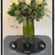 The Camera in Photo mode. At the bottom of the screen are buttons for the following camera controls: Flash, Live, Timer, Exposure, Styles, and Aspect.