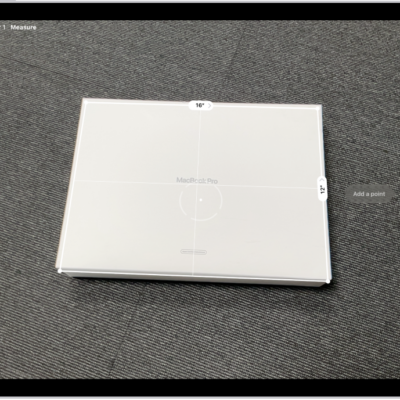 A screen showing the measurement of the dimensions of a box in the Measure app. The area of the box is calculated from the measurements of the dimensions.