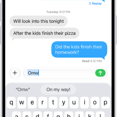 A message with the text shortcut "Omw" typed and the phrase "On my way!" suggested below as replacement text.