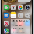 A blurred Home Screen, with the Camera Quick Actions menu showing below the Camera app icon.