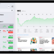 The Stocks screen on iPad includes a chart showing the performance for a stock over the course of a morning. On the left are a list of ticker symbols. Above the chart are buttons to display the stock performance over a week or larger increments of months and years, up to 10 years. Below the chart are stock details such as opening price, high, low, and market cap, and links to business-related news.