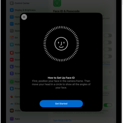 The Face ID recognition setup screen. A smiley face is showing on the screen, enclosed in a circle. Text below instructs the user to move their head slowly to complete the circle. A button for Get Started appears near the bottom of the screen.