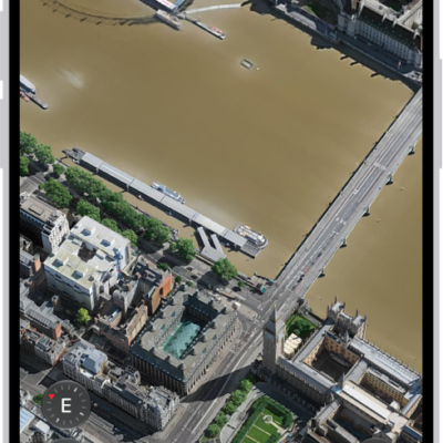A 3D map in the Maps app, showing details of a city.