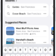 The Maps app showing the search field, categories for nearby services, and city guides. In the bottom part of the screen is the iPhone onscreen keyboard.