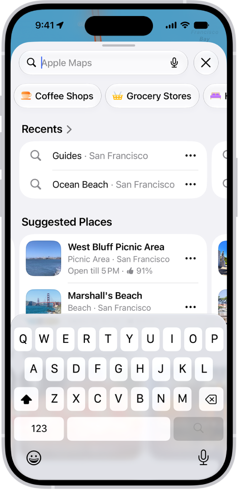 The Maps app showing the search field, categories for nearby services, and city guides. In the bottom part of the screen is the iPhone onscreen keyboard.