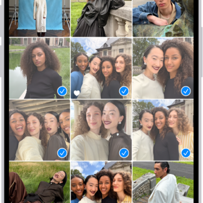 The iPhone screen is filled with a grid of photos, some of which are selected. At the bottom of the screen are the Share and Delete buttons.