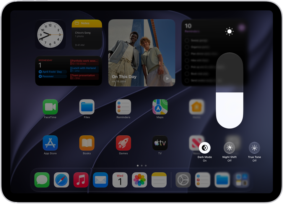 The iPad Home Screen with Dark Mode on.