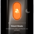 The screen for customizing the Action button. The Camera is the selected action. Other features appear to the right and left of the camera, including Do Not Disturb and Flashlight. Below the actions are dots you can tap to switch to another action. Below the selected action, Camera, is a menu of Camera options you can tap to assign to the Action button.