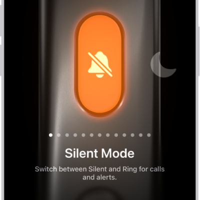 The screen for customizing the Action button. The Camera is the selected action. Other features appear to the right and left of the camera, including Do Not Disturb and Flashlight. Below the actions are dots you can tap to switch to another action. Below the selected action, Camera, is a menu of Camera options you can tap to assign to the Action button.