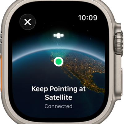 A screen showing a satellite icon over a curved view of Earth, a green connection indicator, and "Keep Pointing at Satellite" text.