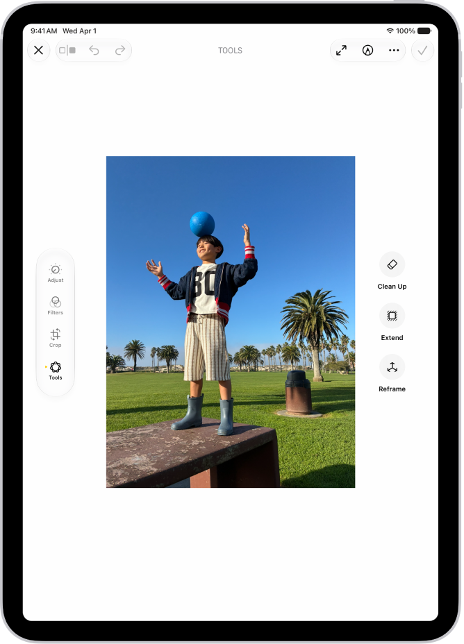 The buttons for Clean Up, Extend, and Reframe are displayed next to a photo.