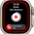 Siren counting down. Near the top is the battery charge, in the middle is a Play button, and at the bottom is the Emergency Call slider.