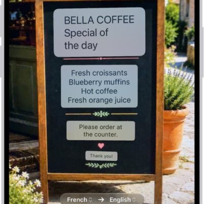 The Camera tab, showing a restaurant menu translated from English to Spanish.