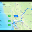 An iPad showing a map with several driving route options to the same destination. Each route shows the estimated time and distance, and a Steps button to see detailed directions. Color coding on each route indicates traffic conditions.