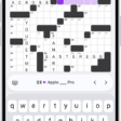 A partially filled crossword puzzle, with controls above it, and a keyboard open at the bottom.